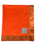 Minky Dot Orange baby blanket with ultra-soft textured plush fabric and smooth satin border, perfect for babies and toddlers.

