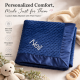 Ivory thread embroidery in Arial font on navy blue minky dot blanket
