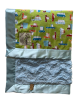 On The Road green cotton baby blanket with colorful cars, soft luxe Bella blue back, and silky light blue satin border.