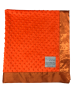 Minky Dot Orange baby blanket with ultra-soft textured plush fabric and smooth satin border, perfect for babies and toddlers.

