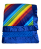 Vibrant rainbow striped baby blanket with royal blue minky dot and shiny satin trim. Ultra-soft, cozy, and perfect for stroller or gifting.