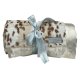 Siberian Leopard Luxe Ivory Throw Blanket with soft plush texture and silky ivory satin trim for a cozy, elegant, and luxurious feel.