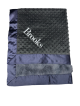 Personalized Minky Dot Luxe Blanket in black with navy satin border and soft fur lining, embroidered with the name "Brooks" in white.