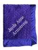 Times New Roman font embroidery in white thread on purple minky dot blanket
