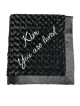 Personalized black luxe rose baby receiving blanket with embroidered text "Kim You are loved" in cursive, soft plush fabric.