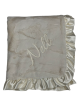 Ivory Luxe Bella baby blanket with ultra-soft plush fabric, elegant ruffle satin trim, and personalized embroidery name "Nell."