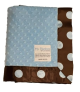 Minky Dot Blue Retro Dot Baby Blanket featuring a soft, textured blue minky dot front and a brown satin backing with large blue polka dots. Plush and cozy with a silky satin trim. Luxury receiving blanket by My Blankeé, perfect for newborns and gifts.