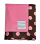 Minky Pink Retro Dot Baby Blanket featuring a soft solid pink front and a brown satin backing with large pink polka dots. Plush and cozy with a silky satin trim. Luxury receiving blanket by My Blankeé, perfect for newborns and gifts.