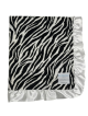 Black and white zebra print Minky blanket with silky white satin ruffle trim, ultra-soft and luxurious, perfect for snuggling and gifting.