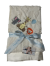 Soft cream Luxe Bella baby blanket with satin trim, featuring adorable embroidered baby animals—lion, giraffe, and elephant with a balloon.