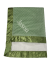 Personalized Minky Dot Luxe Baby Blanket in Sage green with a satin border and plush white lining, embroidered with the name "Jaxon" in white.