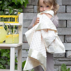 Young girl holding blanket