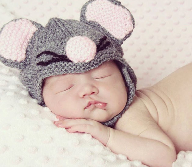 Baby sleeping with mouse ears
